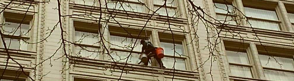 high rise window cleaning technician